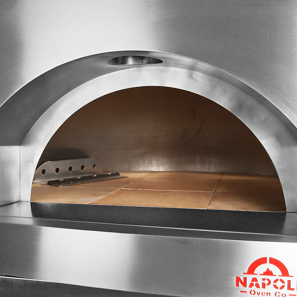 Dual insulated wide mouth oven entry and stainless steel wood holder.Authentic Wood fired pizza oven with stainless steel stand. Premium Pizza oven